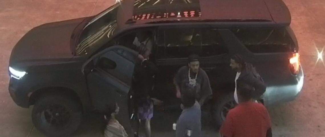 A group of men gathers on Monday, April 6, 2026, in front of a Chevrolet Tahoe SUV parked at the Seminole Hard Rock Hotel & Casino, where rapper Offset was shot. 